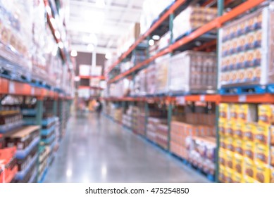 Blurred image of shelves in modern distribution warehouse or storehouse. Defocused background of industrial warehouse interior aisle. inventory, wholesale, logistic and export concept. Vintage filter.