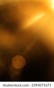 blurred image. shiny sun, sunbeams, sunrays, sunshine design. Yellow orange warm light effect, sun rays, golden beams isolated on black background. star dust - Shutterstock ID 2395071671