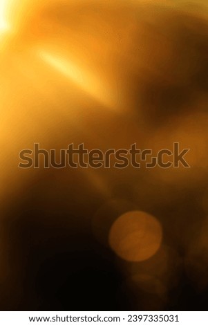 blurred image. shiny sun, sunbeams, sunrays, sunshine design. Yellow orange warm light effect, sun rays, golden beams isolated on black background. star dust