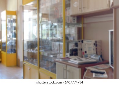 Blurred Image Of Shop Window And Auto Parts Store Shelves. Abstract Interior Of Retail Store.