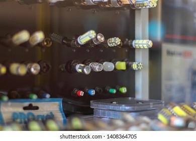 Blurred Image Of Shop Window And Auto Parts Store Shelves. Abstract Interior Of Retail Store.