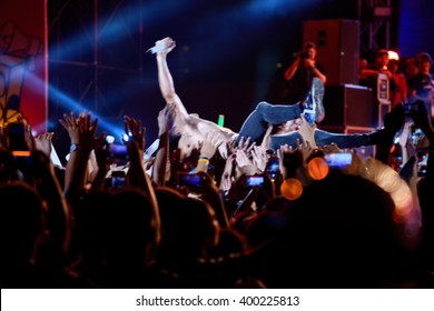 Blurred Image Of Singer On Top Crowd Surfing At A Music Concert