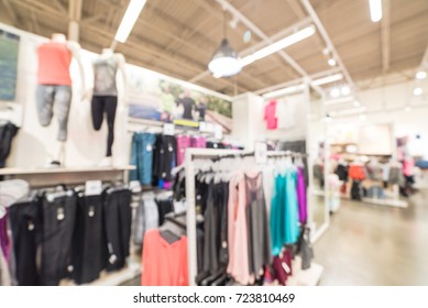 Blurred Image Sport And Fitness Department In Clothing Store In America. Activewear Shop With Mannequin  On Sportswear And Wardrobe Showcase Of Athletic Shoes, Gear, Apparel. Healthy Lifestyle Concept