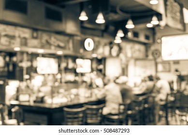 Blurred Image Sport And Gumbo, Oyster Bar With TV, Classic Counter, Tables And Chairs In Houston, Texas, US. Bar Happy Hour, Dine In Abstract Background. Night Club, Grill Bar Concept. Vintage Filter.