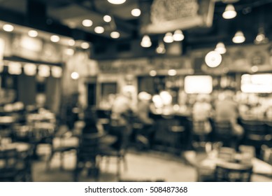 Blurred Image Sport And Gumbo, Oyster Bar With TV, Classic Counter, Tables And Chairs In Houston, Texas, US. Bar Happy Hour, Dine In Abstract Background. Night Club, Grill Bar Concept. Vintage Filter.