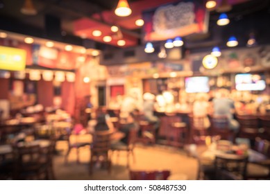 Blurred Image Sport And Gumbo, Oyster Bar With TV, Classic Counter, Tables And Chairs In Houston, Texas, US. Bar Happy Hour, Dine In Abstract Background. Night Club, Grill Bar Concept. Vintage Filter.