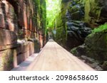 a blurred image of the steep granite walls of the gorge at the flume in lincoln new hampshire.