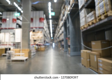 Blurred Image Of Stock Inventory Shelf, Stack Of Carton Boxes, Modern Logistics Smart Warehouse Management. For Wholesale Distributor, Ecommerce, Commercial Business Or Supply Chain Background Concept