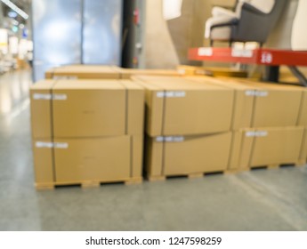 Blurred image of stock inventory, stack of brown paper carton boxes, modern logistics smart warehouse management. Houseware, furniture wholesale distributor business or supply chain background concept