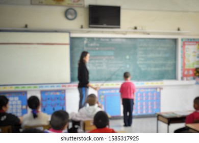 Blurred Image, Teacher Used The Stick To Hit The Elementary School Students In Front Of The Class