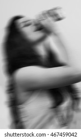 Blurred Image Of Teenage Girl Binge Drinking