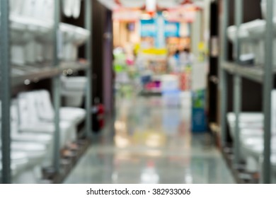 Blurred Image Of Toilet Bowls Aisle In A Hardware Store.