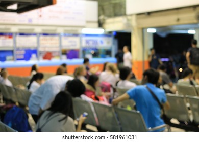 Blurred image of tourist and people in transportation waiting for the bus on vocation in long weekend at night time ,Abstract background