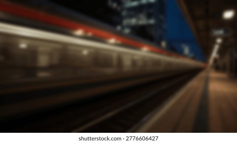 A blurred image of a train speeding through a station at night, showcasing motion blur and the dynamic movement of the train. The lights create streaks.