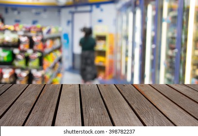 Blurred Image Wood Table And Abstract Convenience Store 