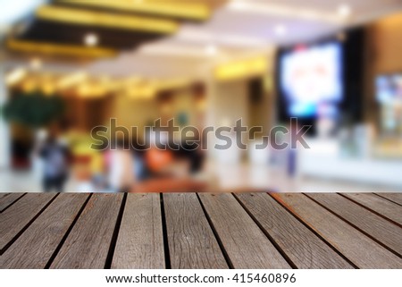 blurred image wood table and abstract theather ticket counter