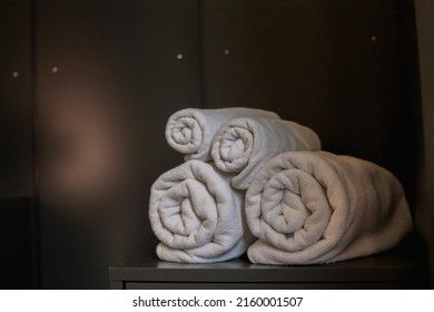 Blurred Image,Rolls Of Clean White Spa Towels Are Folded Next To The Mattress To Be Ready For Customers To Use When It's Time To Take A Shower Because Towels Are Essential For Guests To Stay.