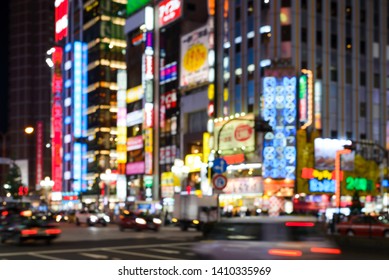 Blurred Images Of Bokeh Light And Renown Night Life Around Shinjuku Neighborhood. Street Illuminated At Night