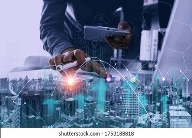 Blurred Images Of Businesswoman Hand  Working On Digital Marketing And Internet Network Technology And City Background. Double Exposure.