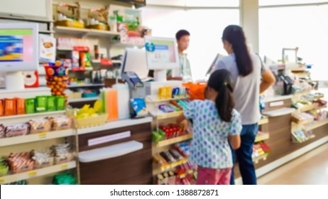 Blurred Images Of Cashier In A Convenience Store.