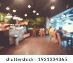 Blurred images of the coffee shop cafe interior background and lighting bokeh