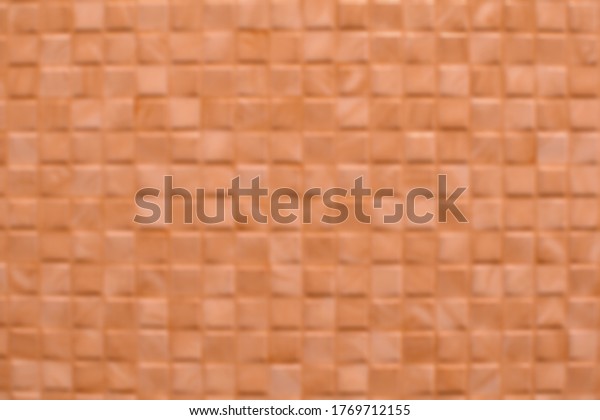 Blurred images for creating backgrounds, square\
shapes of light red brick\
walls