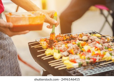 Blurred images , A group of colleagues held a barbecue party. (BBQ) inside the villa after work to celebrate success. Barbecue (BBQ) Allows family members and friends to have activities together. - Powered by Shutterstock