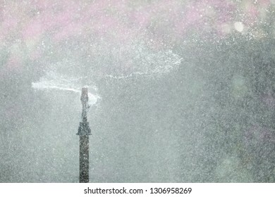 Blurred Images From Water Spray, Dust Prevention Smog City From PM 2.5 Dust. With Bad Weather And Air Pollution.concept For Background Or Copy Space