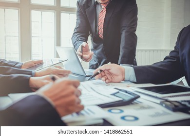 Blurred images,A group of business people talking about the business reports of the project planning board in the meeting room and summarizing the total of privatization of real estate in the project