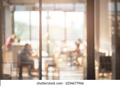 Blurred immage of customer in coffee shop withe blur background. Vintage filter tones.