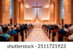 Blurred interior of a church with pews filled by people during a service, centered around a large cross at the altar