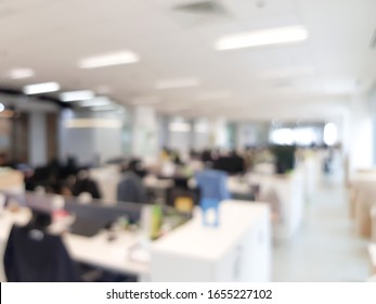 Blurred Interior Of Modern Office Workplace A Workspace Design Without Partition Decorate With Black, White And Wooden Furniture. Nice Environment Can Create Work Productivity, Relax Mood.