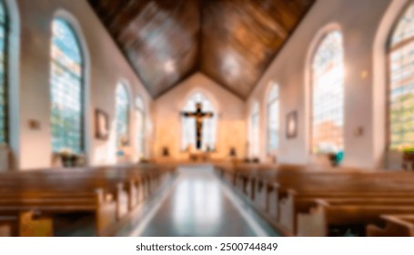 Blurred interior of a small, intimate church with wooden pews, large stained glass windows, and a prominent crucifix at the altar, creating a peaceful and reflective atmosphere. - Powered by Shutterstock