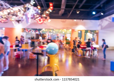 Blurred Kids And Parents Playing At Science Educational Museum In America