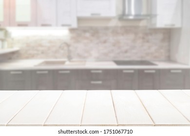 Blurred kitchen interior and white wooden table background. Mock up for display or montage product. - Shutterstock ID 1751067710