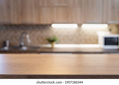 blurred kitchen interior   wooden desk space home background