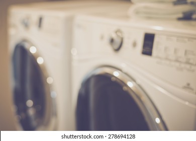 Blurred Laundry Room With Washer And Dryer With Retro Instagram Style Filter