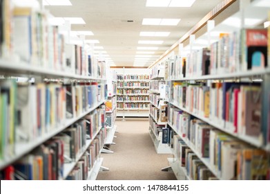 Blurred Library Hallway, Book Shelf At The End