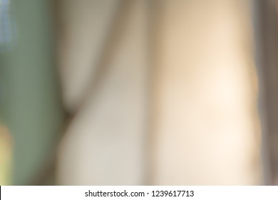 Blurred light brown   green tone for background  Shape like fat woman back 