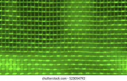 Blurred of light impact on wire mesh on green background.