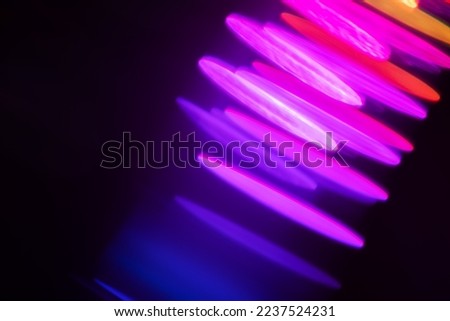 Blurred Light painting one exposure in camera. light glares with a spectral gradient on a dark background. Multicolored abstract colorful line. Unusual light effect. Stok fotoğraf © 