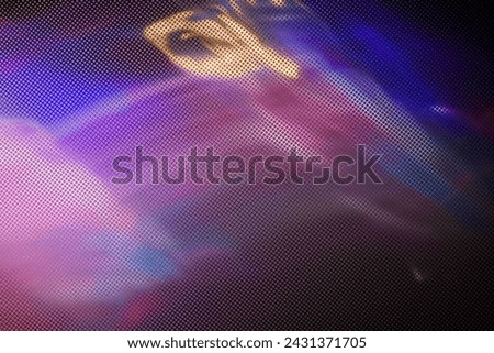 Blurred Light painting one exposure in camera with textured glass. light glares with a spectral gradient on a dark background. Multicolored abstract colorful line. Unusual light effect.