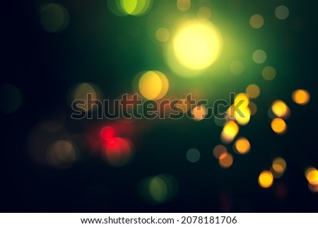 BLURRED LIGHTS BACKGROUND, DARK GLOWING BOKEH PATTERN, MAGICAL GREEN RED ORANGE SPARKLING CIRCLE BACKDROP, FESTIVE DESGIN