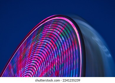 Blurred lights of carnival ferris wheel in detail