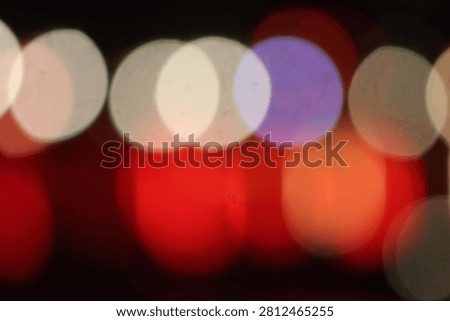 Blurred lights multicolour defocused glitter lights background. Rounded defocused lights. Abstract bokeh back