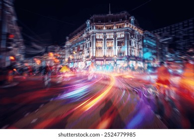 Blurred lights streak across a bustling city street at night. - Powered by Shutterstock