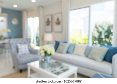 Blurred Living Room With Blue Tone Wall And Sofa For Background