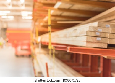 Blurred Lumber Wholesale Yard With Divider Cart At Hardware Store In America. Rack Of Fresh Mill/cut Wood Timber In Warehouse, Pegboard, Plywood, Osb Paneling, Mdf. Industrial Background