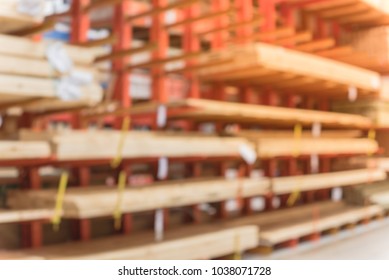 Blurred Lumber Wholesale Yard At Hardware Store In America. Rack Of Fresh Mill/cut Wood Timber In Warehouse, Pegboard, Plywood, Osb Paneling, Mdf. Industrial Background