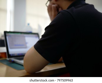 blurred of man using computer find Information .